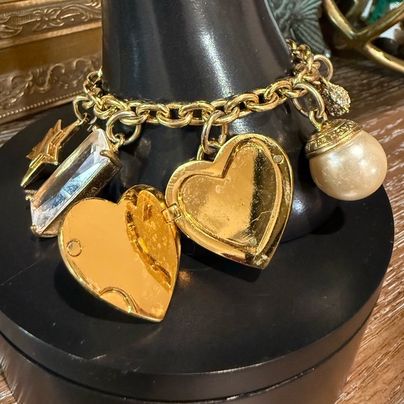 Coach Gold Tone Multi Charm Bracelet. Includes locket Heart, Bird, Star and more - Picture 10 of 17